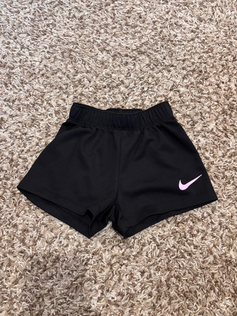 Nike Black Athletic Shorts with Pink Swoosh Accent - 24M